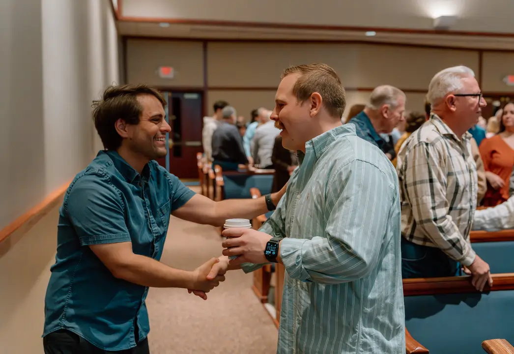 Church members greeting one another after a service